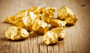 Or 24 carat sur fond bois